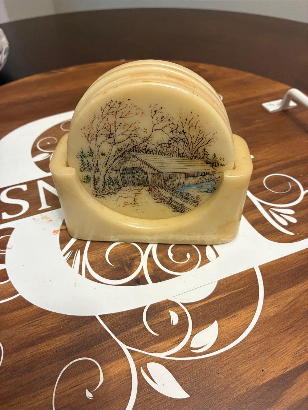 Unbranded ivory polymer resin Tone Vintage Covered Bridge Coaster complete set